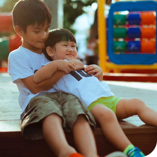 brothers playing at playground